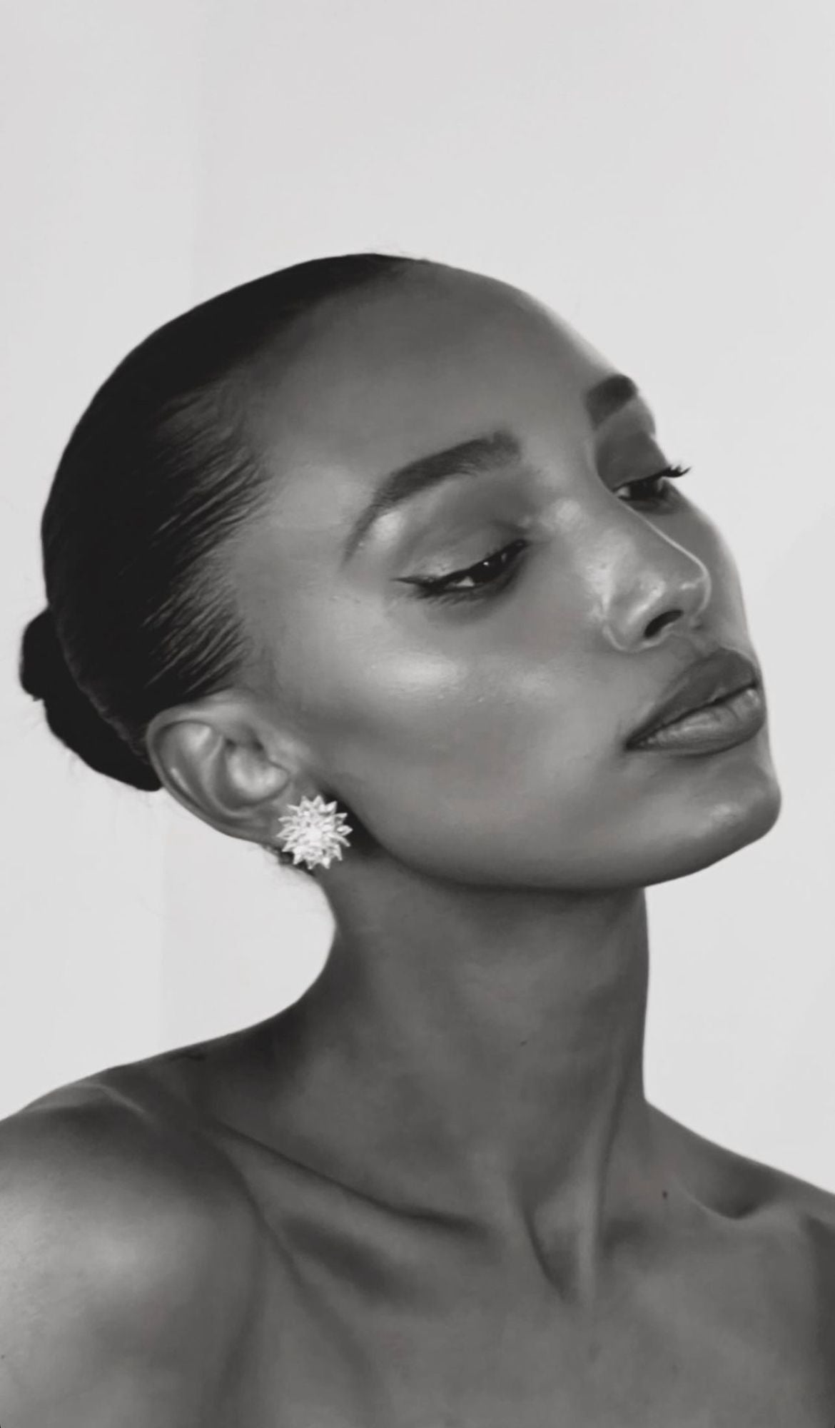 Image of jasmine tookes wearing 64facets diamond spiked earrings