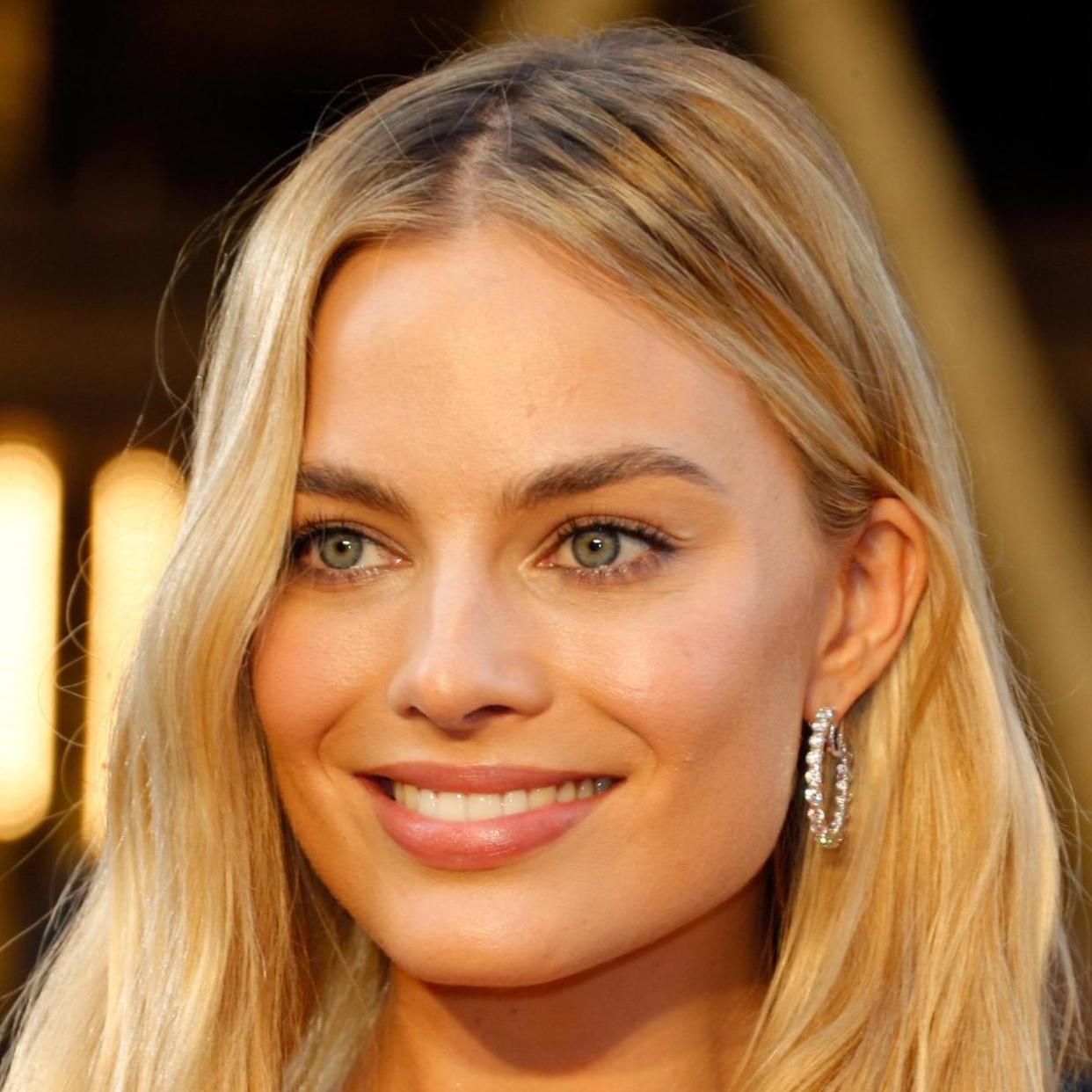 Image of Margot Robbie wearing diamond hoop earrings