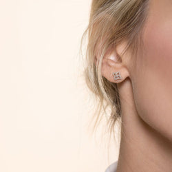 Image of 64facets diamond stud earrings in the shape of blossoms set in 18k gold