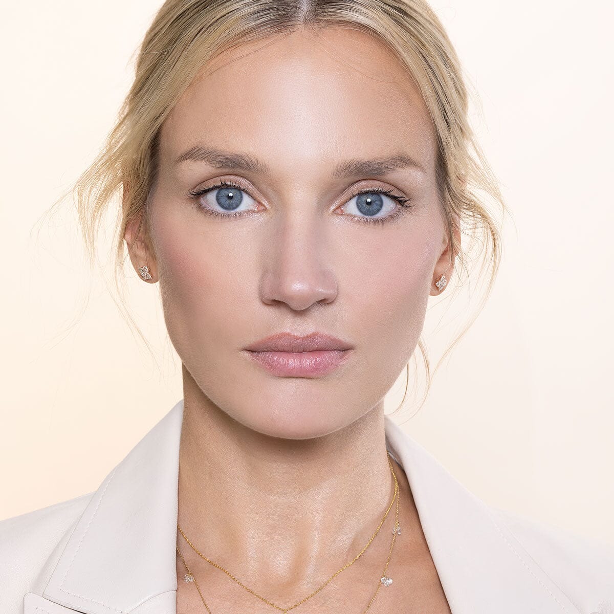 Image of 64facets diamond stud earrings in the shape of blossoms set in 18k gold