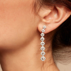 Image of Diamond dangle earrings on model. Rose cut diamonds with brilliant cut diamonds in a micro pave setting. 