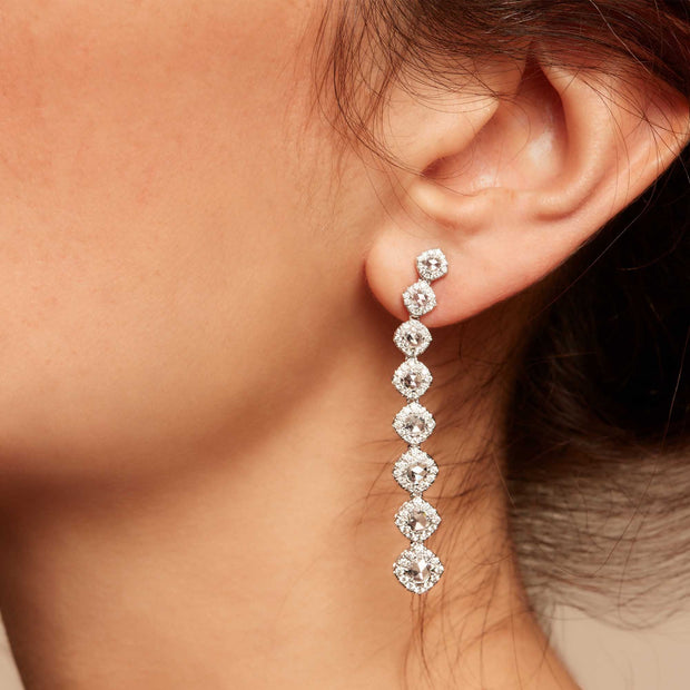 Diamond dangle earrings on model. Rose cut diamonds with brilliant cut diamonds in a micro pave setting. 