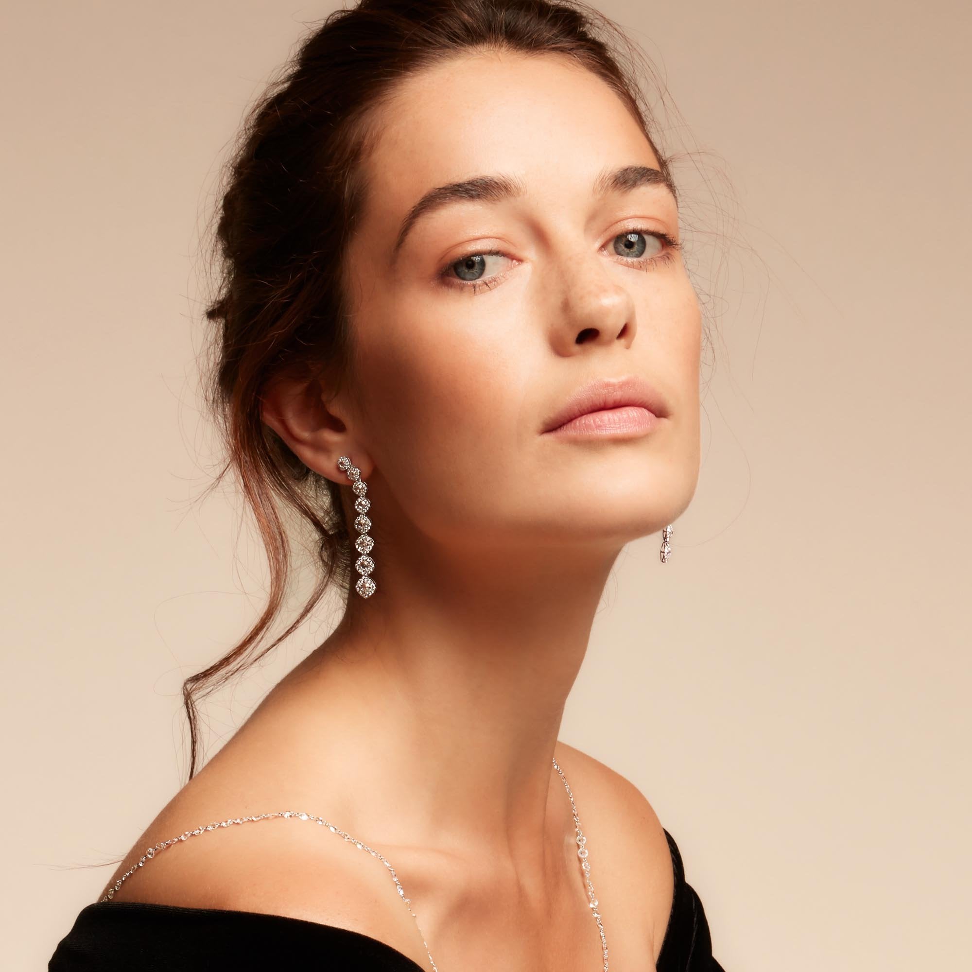 Image of Diamond dangle earrings on model. Rose cut diamonds with brilliant cut diamonds in a micro pave setting. 