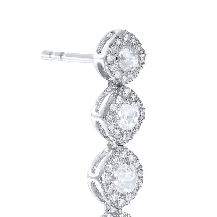Diamond dangle earrings close up. Rose cut diamonds with brilliant cut diamonds in a micro pave setting. 