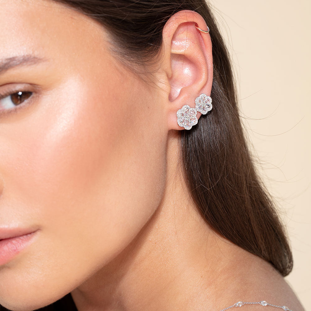 Image of 64Facets diamond stud earrings in the shape of two flowers set in gold
