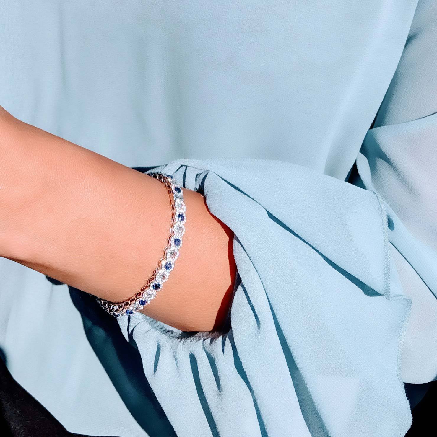 Image of Sapphire gemstone and diamond bangle. Rose-cut gemstone and diamond bracelet.