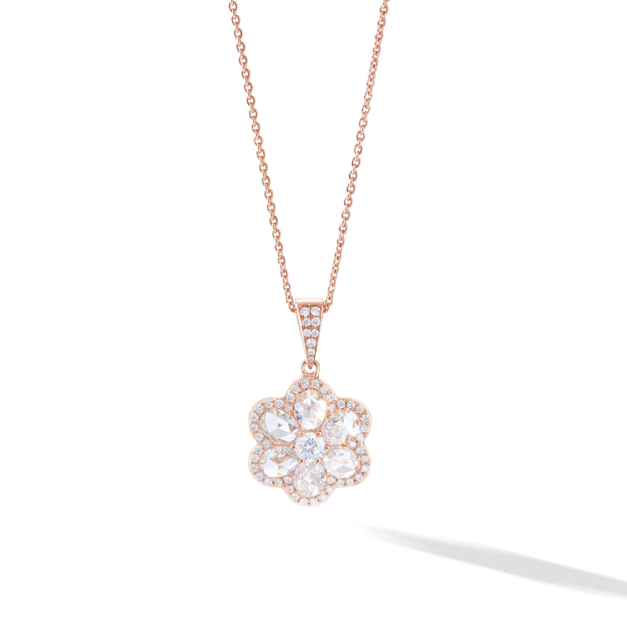 Image of diamond pendant in the shape of a flower in 18k gold
