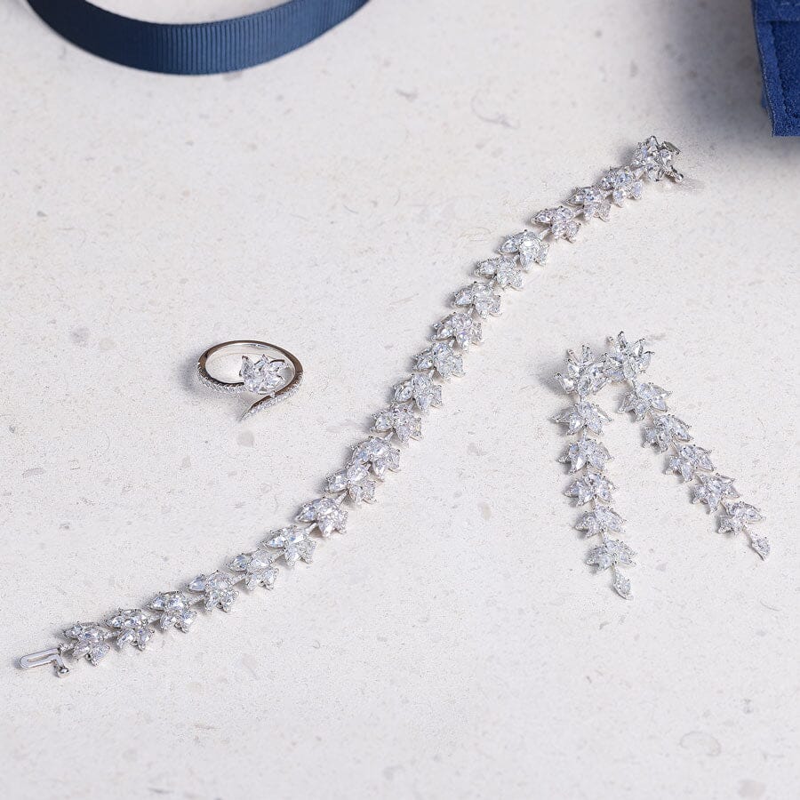 Image of 64facets diamond lotus collection with diamond ring, tennis bracelet and earrings