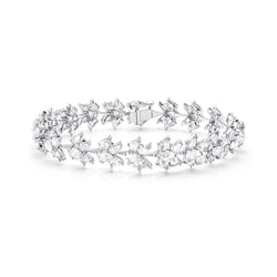 Image of 64facets diamond bracelet in the shape of lotus flowers and set in 18k gold