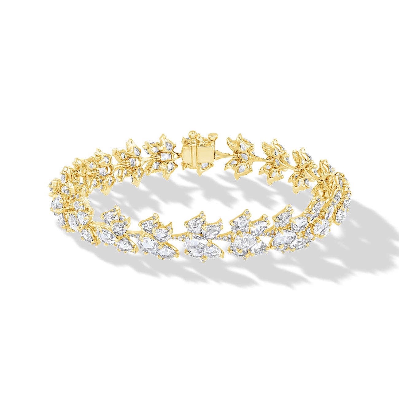 Image of 64facets diamond bracelet in the shape of lotus flowers and set in 18k gold