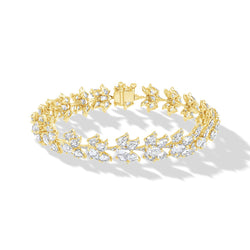 Image of 64facets diamond bracelet in the shape of lotus flowers and set in 18k gold