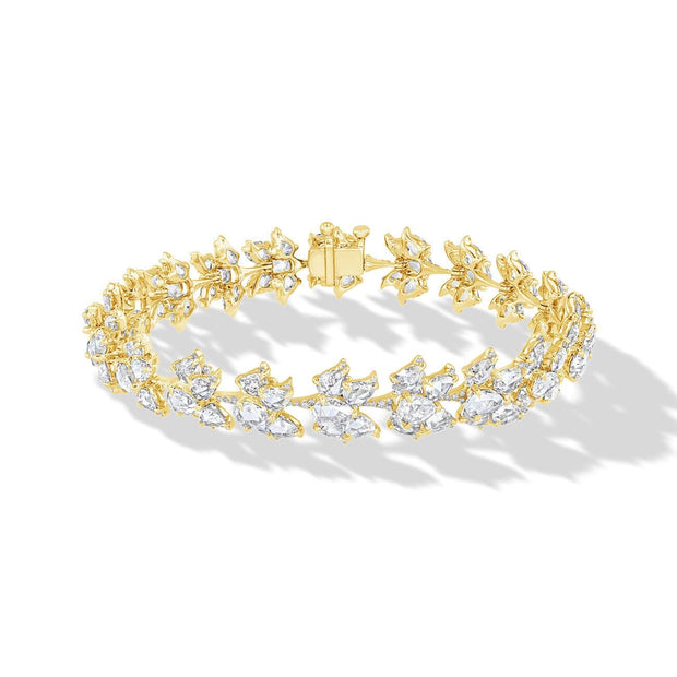 64facets diamond bracelet in the shape of lotus flowers and set in 18k gold