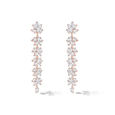 64facets diamond dangle earrings made with diamonds in the shape of lotus flowers and set in 18k gold