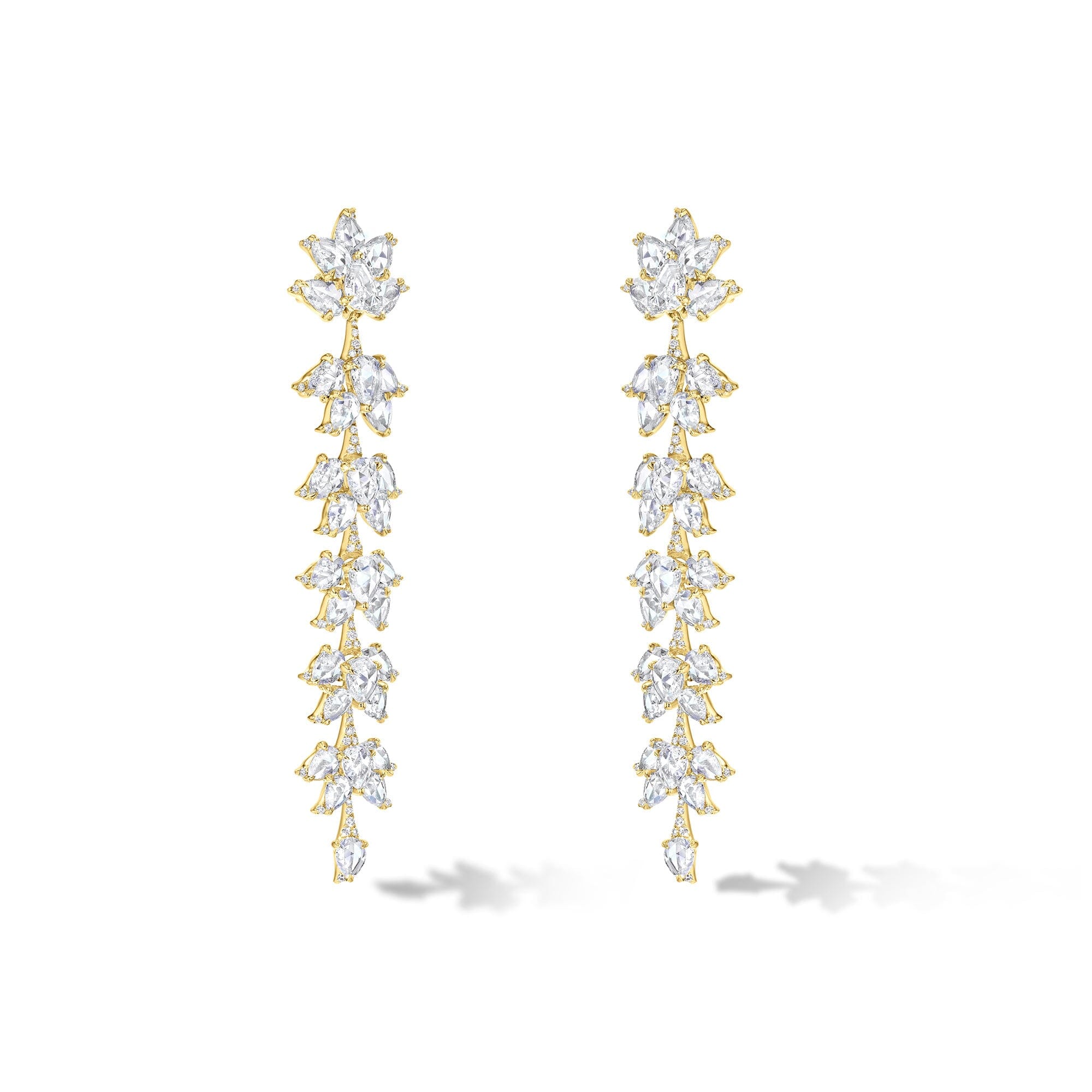 Image of 64facets diamond dangle earrings made with diamonds in the shape of lotus flowers and set in 18k gold