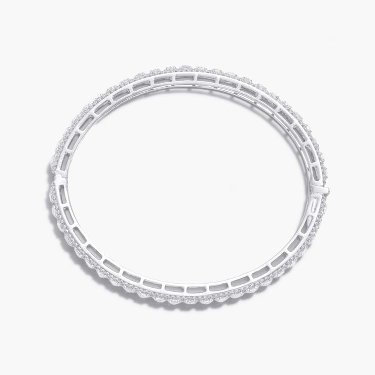 Oval Shaped Scallop Diamond Bangle Bracelet. Round rose-cut diamonds accented by round brilliant cut diamonds. 18k White Gold.