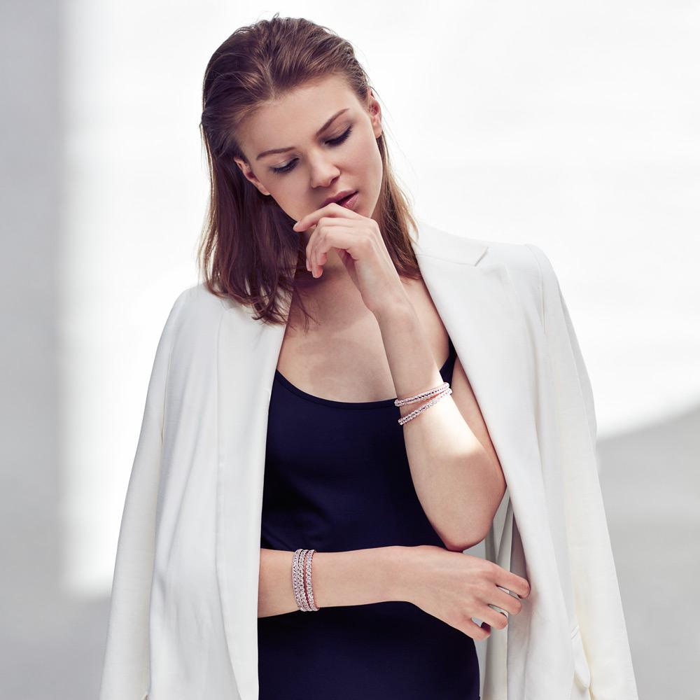 Image of Stacked Scallop Diamond Bangles. Round rose-cut diamonds accented by round brilliant cut diamonds. 18k Rose and White Gold.