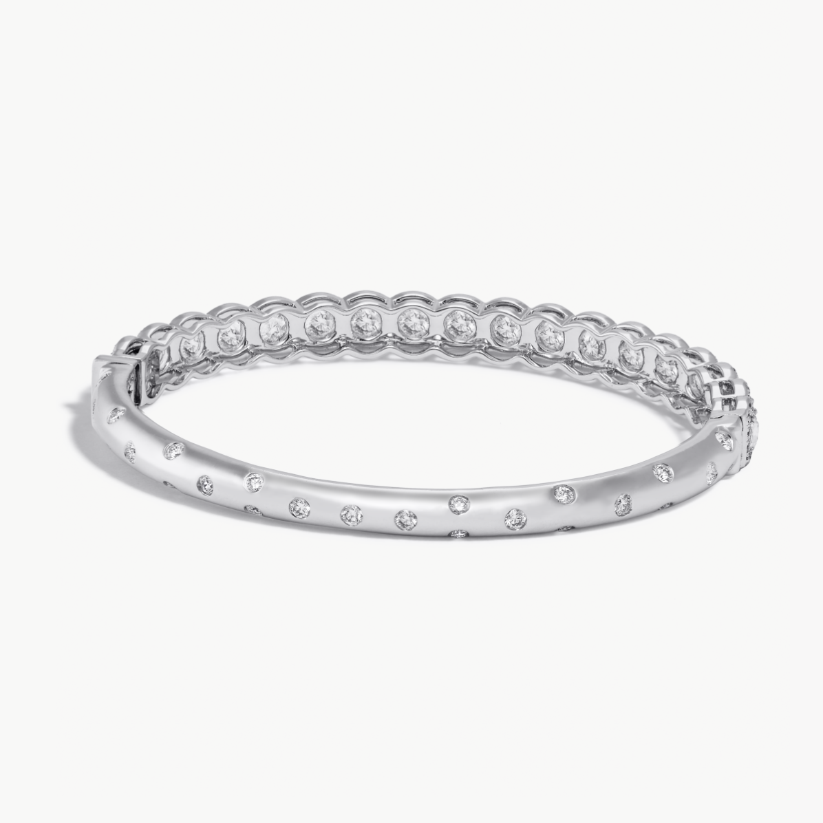 Image of Back Side of Oval Shaped Hinged Diamond Half-Bangle. Round rose-cut diamonds accented by round brilliant-cut diamonds on front-side, with pave diamonds spread out on the back-side. 18k White Gold. 