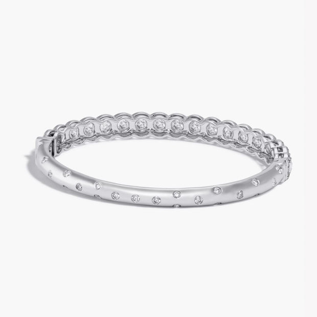 Back Side of Oval Shaped Hinged Diamond Half-Bangle. Round rose-cut diamonds accented by round brilliant-cut diamonds on front-side, with pave diamonds spread out on the back-side. 18k White Gold. 