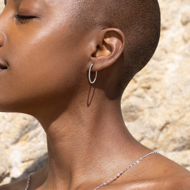 Micro pave diamond think hoop earrings in 18k gold