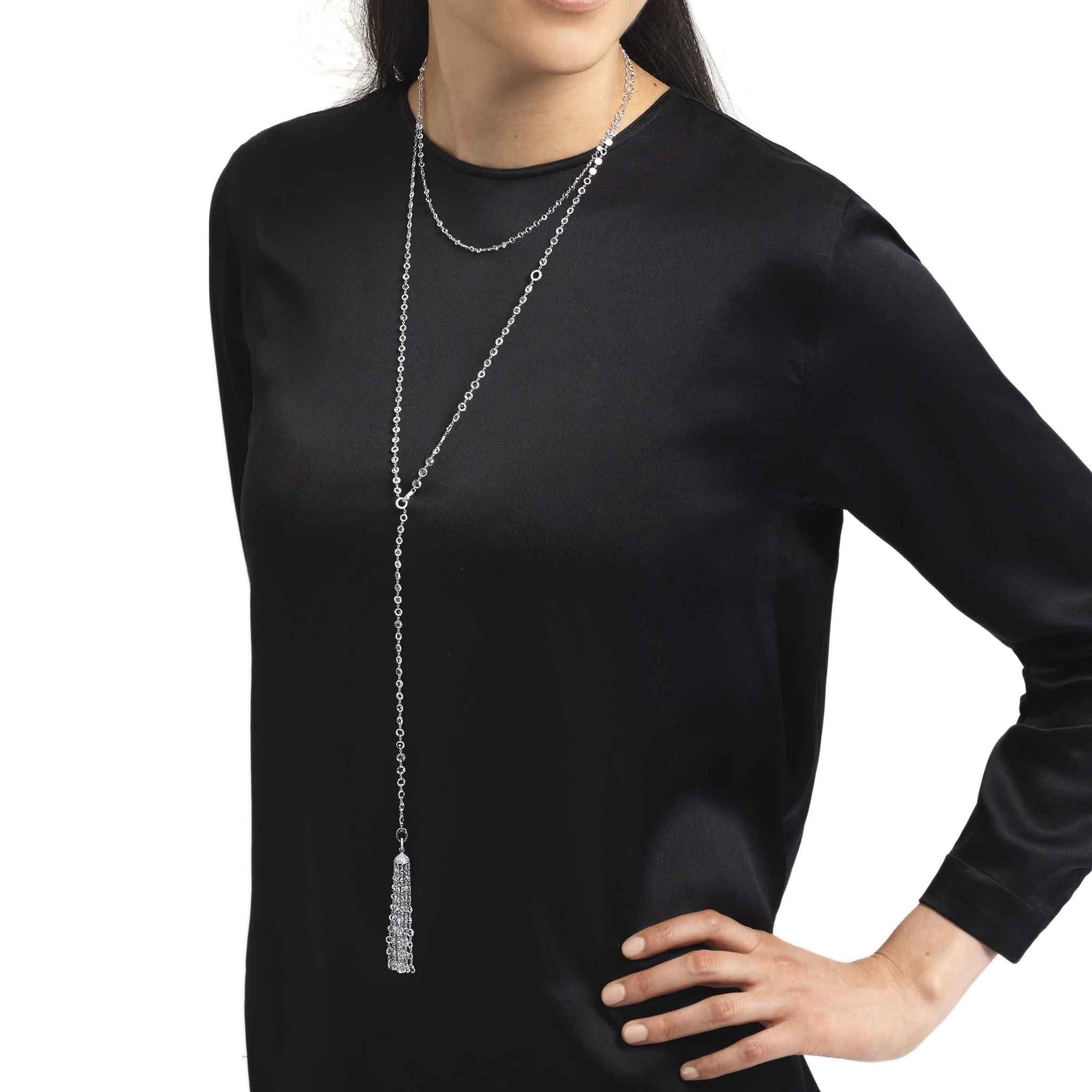 Image of Model wearing ethereal diamond tassel pendant and ethereal rose cut diamond chain necklace. 