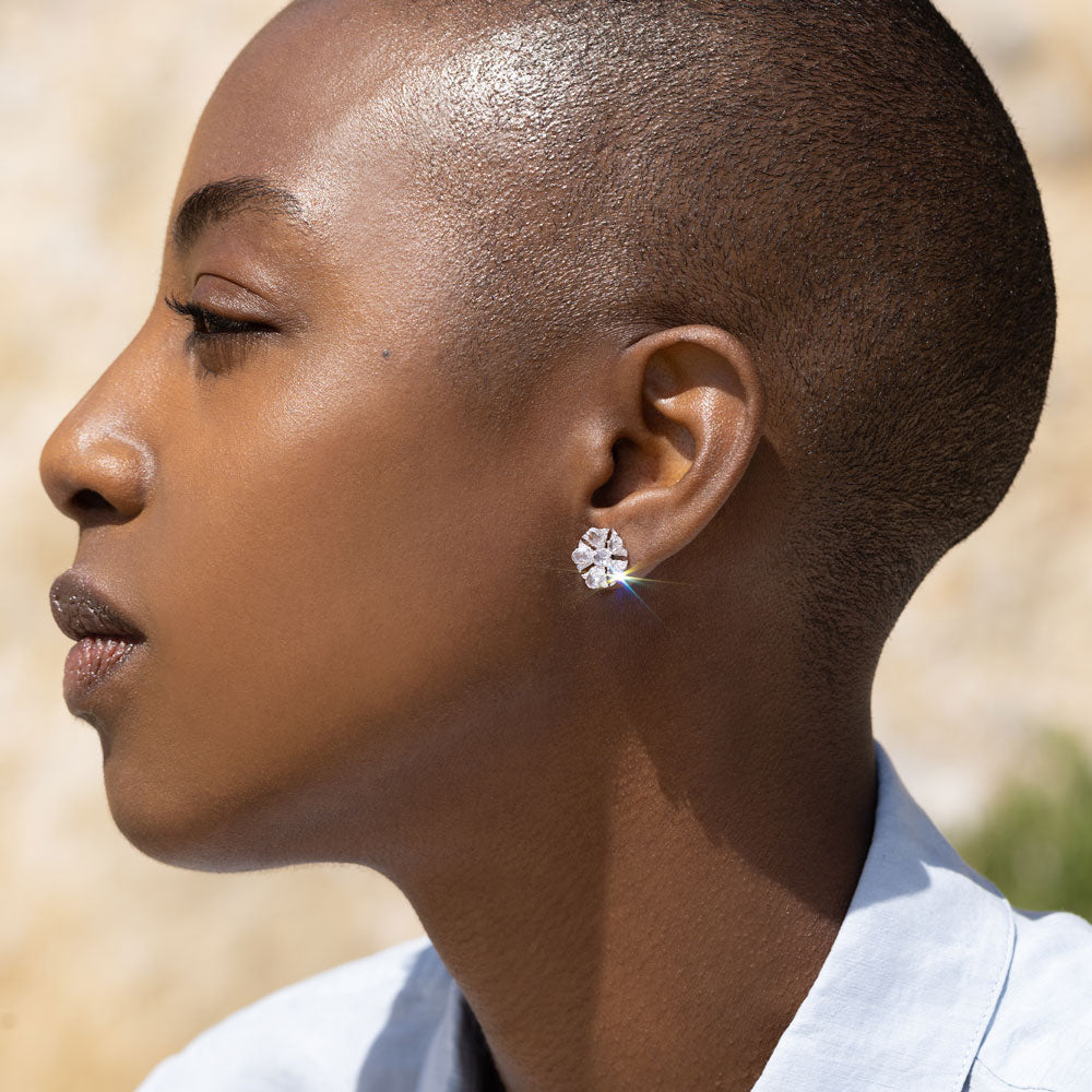 Image of 64facets rose cut diamond stud earrings in the shape of tulip flowers and set in 18k gold